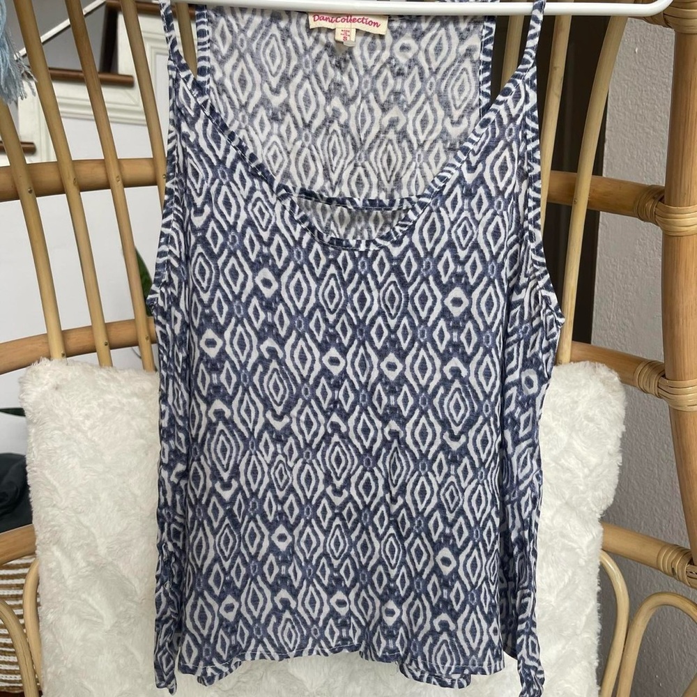 Used - excellent condition. Dani Collection tank!